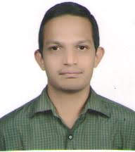 Professional headshot of a person in business attire presenting a polished and approachable appearance.