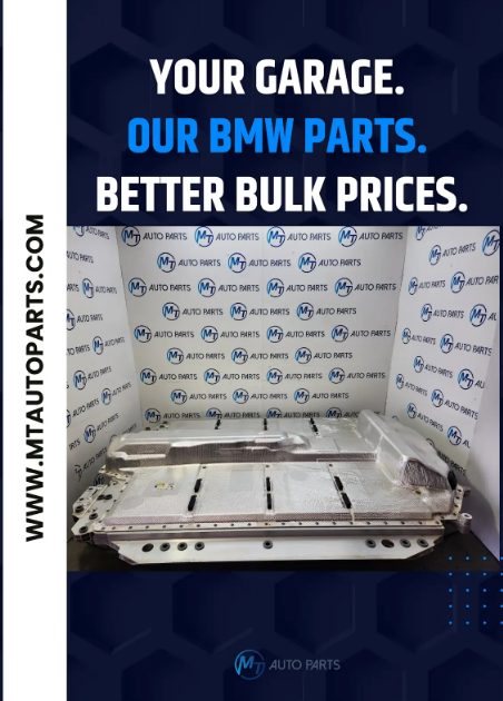 A collection of various used BMW automotive parts displayed together in a workshop or storage setting.