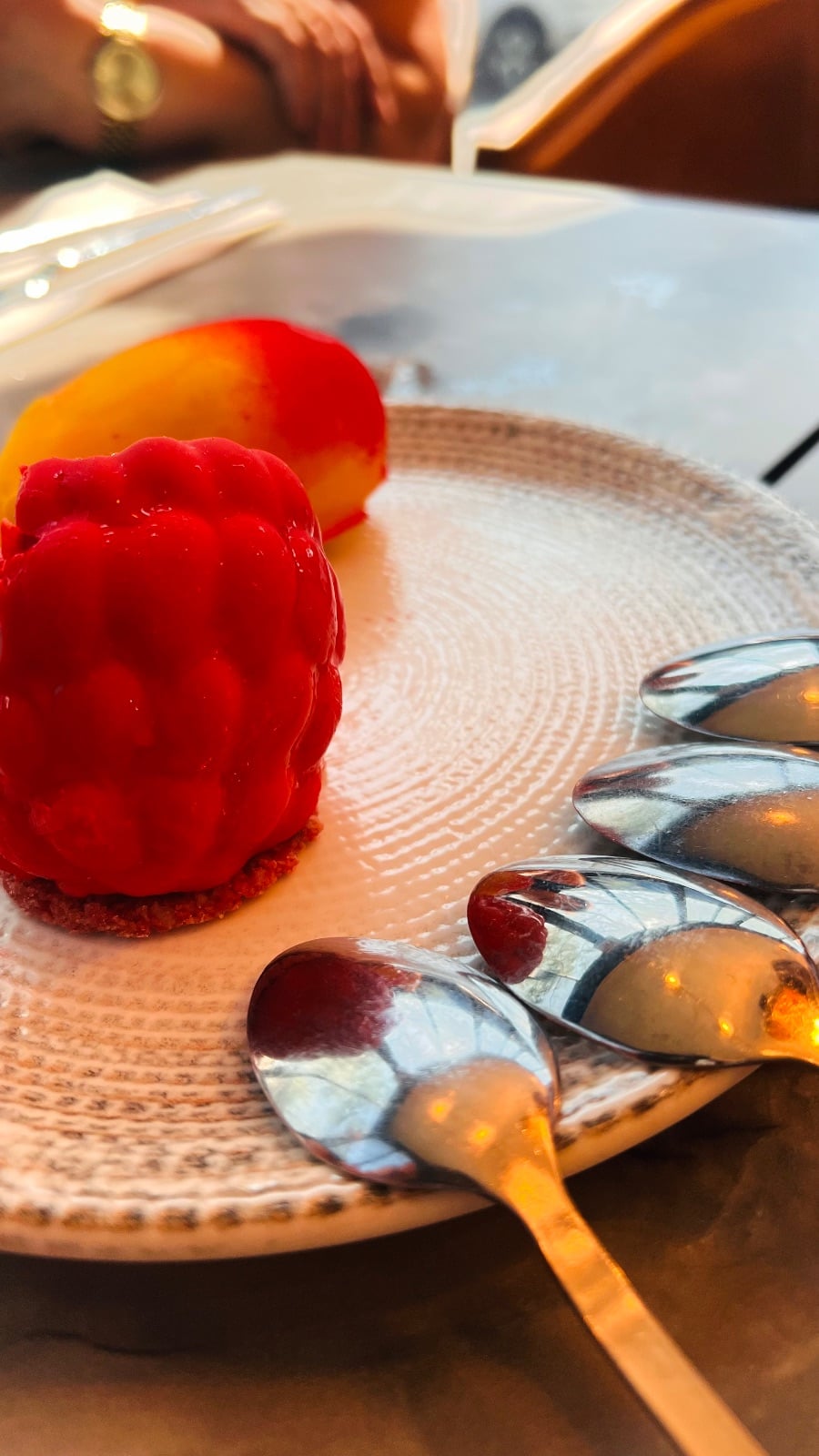 Red bell peppers displayed whole, showing their glossy, smooth surface and characteristic shape.